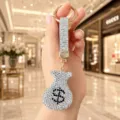 Porte-clés sac d'argent en strass, pendentif de clé de voiture signe dollar luxueux. - Blanc