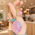 Pink acrylic lemon keychain detail shot, cute bag charm pendant with green leaf and glitter. - Acrylic Jelly Lemon (Pink)
