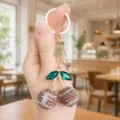 Rhinestone football cherry keychain, stylish bag charm and car key ring accessory for women. - Football Mom Style