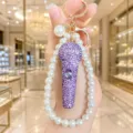 Strass Mikrofon Schlüsselanhänger Perlen Tasche Anhänger glänzende Luxus Schlüsselring Damen. - Mikrofon Perlenstrang / Lila