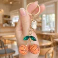 Chic basketball cherry keychain with green crystal leaves and gold hardware for bags. - Basketball
