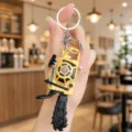 Detailed close-up of the miniature chainsaw keychain featuring a realistic tool design. - Chainsaw Style / Yellow