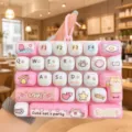Cute cat mini keyboard keychain toy, pink stress relief fidget charm for school bag backpacks. - 26-Key Stress Relief Keyboard (Pink Cat Party)