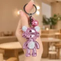 Portachiavi a forma di orsetto con strass galvanizzato e finitura metallica lucida elegante. - Orso Sfumato Galvanico Strass / Rosa