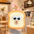 Silicone toast bread squeeze keychain cute stress relief toy backpack pendant detail view - Toast Dessert Bubble Blowing