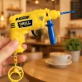 Mini electric drill keychain decompression toy, creative yellow plastic tool pendant. - Electric Drill Gun (Yellow)