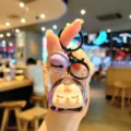 Cute acrylic quicksand keychain, cartoon doll bag pendant and stylish key chain accessory. - Purple