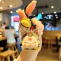 Cute acrylic quicksand keychain with bell, lovely cartoon pendant for bags and car keys gifts. - Yellow