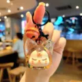 Cute Kiki acrylic quicksand bottle keychain, stylish bag pendant and lovely gift for friends. - Orange