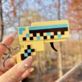 Creative mini pixel gun keychain, portable decompression toy with spark design for gift. - Block Flint Gun (Coffee)