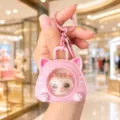 Cute cartoon cat changing face capsule keychain bag charm, creative stress relief toy pendant for keys. - Vocal Face Changing Style / Pink