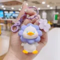 Cute cartoon resin sunflower duck keychain and bag pendant for women fashion accessories detail shot - Purple Flower Duck