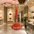 Orange rhinestone football keychain, sparkling crystal sports bag charm pendant accessory. - Rhinestone Rugby (Rhinestone Rugby) / Orange Yellow