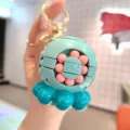 Creative decompression magic bean rotating puzzle toy keychain, cute bag pendant accessory. - Verdant