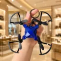Mini folding drone keychain pendant with black propeller guards and sturdy metal ring. - Mini Foldable Drone / Blue