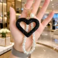 Korean rhinestone hollow heart keychain with pearl chain, black crystal peach heart bag pendant. - Black