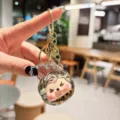 Cute liquid quicksand acrylic keychain charm pendant for bags and keys, cartoon design. - Glitter My Melody (Black Gold)