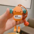 Portachiavi dinosauro carino con arti a molla, ciondolo per borsa alla moda e chic. - Stile Rancoroso / Arancione