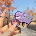 Mini metal flint toy gun keychain with creative gear design, purple portable decompression pendant. - Metallic Flint Gun (Purple)