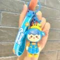 Cute blue cartoon doll keychain with silicone strap and metal ring for bags and keys. - Electroplated Girl - Blue