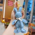 Cute blue PU leather rabbit keychain with bow, stylish metal keyring bag charm pendant. - Light Blue