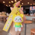 Detail view of the colorful electroplated cross-eye bear keychain with yellow leather strap. - Electroplated X-Eye Bear - Yellow
