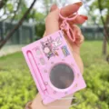 Pink electronic drum set keychain toy with mini drumstick pen and cute rabbit graphic. - Electronic Drum Set / Pink Rabbit