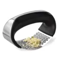 Stainless steel garlic press with black ergonomic handle, curved mincer for kitchen use. - Garlic Press (Boxed)