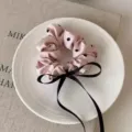 Pink polka dot satin hair scrunchie with a black ribbon bow for women and girls hair styling. - E Style-Pink Polka Dot Ribbon
