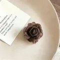 Brown fabric rose hair claw clip detail shot, elegant floral hair accessory for women half-up styles. - Dark Brown