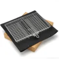 Stainless steel folding BBQ grill basket with black fabric mat for outdoor cooking tools. - BBQ Grill Net (Storage Bag + Boxed)
