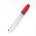 Professional stainless steel cheese grater with red handle and protective cover for kitchen use. - Round Grater / Red