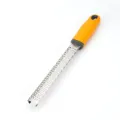 Stainless steel cheese grater with ergonomic orange and grey handle for kitchen use. - Round Grater / Yellow