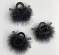 Detailed view of black feather hair claw featuring fluffy texture and chic mesh bow accent. - Turkey Feather Hair Claw / Black