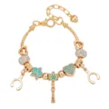 Dettaglio bracciale con ciondoli dorati con cuore in strass, fiore smaltato e pendenti graziosi. - Fiore Blu Nappa