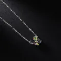 Close-up of silver-tone necklace with colorful rhinestone LOVE pendant jewelry detail. - LOVE Silver Multicolor