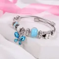 Bracciale rigido farfalla cristallo blu perline acciaio titanio gioiello dettaglio - Blu lago