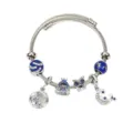 Bracciale rigido in acciaio inossidabile con ciondoli luna stella e gufo vista dettaglio. - Gufo