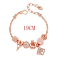 Bracciale con ciondoli in oro rosa con lucchetto a cuore e corona, gioiello chic. - Ventaglio 18cm