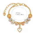 Bracciale con ciondoli in lega dorata con strass e perline a cuore, regolabile 18+5 cm. - 18cm / Oro