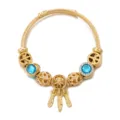 Bracciale rigido in acciaio inossidabile dorato con perle di cristallo blu e acchiappasogni. - Blu