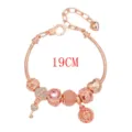 Splendido bracciale con charm in oro rosa con perline di cristallo rosa e lucchetto. - Perla Rotonda 18cm