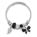 Silver stainless steel charm bangle bracelet featuring black crystal beads and butterfly leaf pendants. - Black