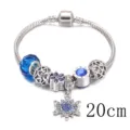Bracciale con ciondoli in argento con perline blu, fiore viola e pendente fiocco, 20cm. - Blu / 20cm