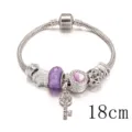 Elegante bracciale con ciondoli in argento, perle viola e chiave pendente, lunghezza 18cm. - 18cm / Viola