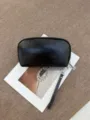 Schwarze Kosmetiktasche aus Leder, halbrunde Reise-Clutch mit Handschlaufe für Damen. - 22*5.5*12CM / Schwarz