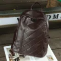Detailed view of the dark brown genuine leather quilted backpack showcasing soft texture. - 35x32x17cm / Embossed Coffee