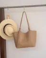 Khaki leather tote bag scene detail showing shoulder strap, metal buckle, and stitching. - Top 40/Bottom 31*9*28CM / Milk Apricot