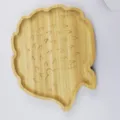 Detail view of a cute hedgehog shaped wooden tray, perfect for serving fruits and snacks. - Hedgehog