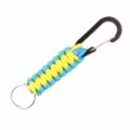 Closeup of blue and yellow paracord keychain with black carabiner and metal ring detail. - Blue and Yellow